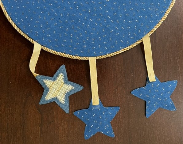 Back view, showing gold cording on outside edge of circle.